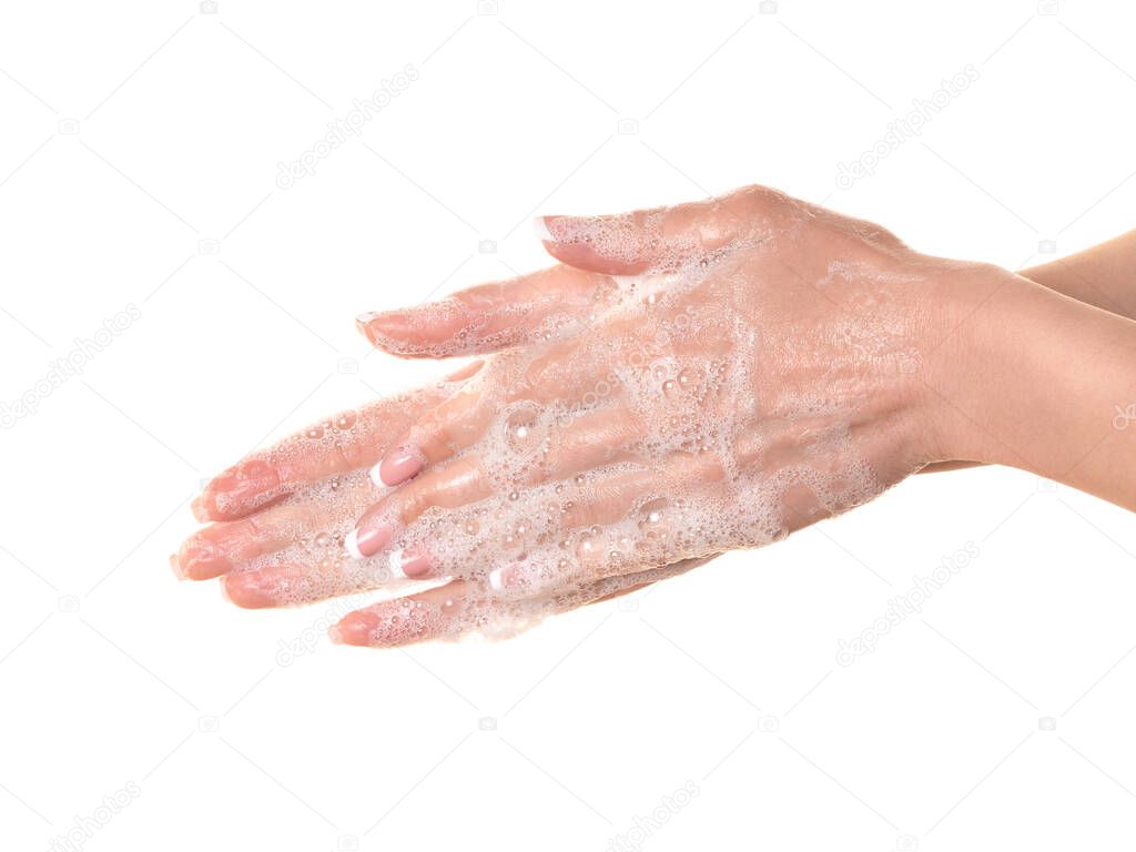 After tactile contact. Caucasian woman soap up her hands to avoid infection, close up, isolated on white.