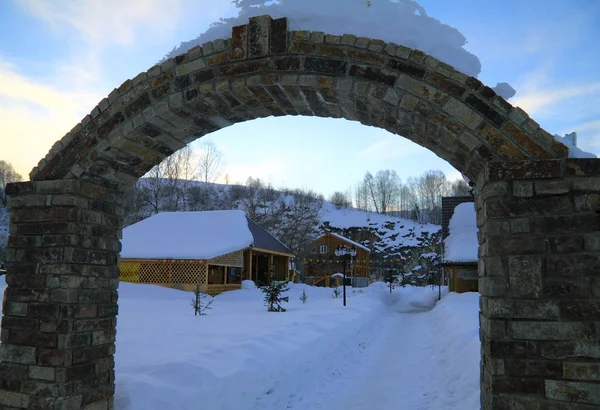 Winter camp site through an arch — Stock Photo, Image