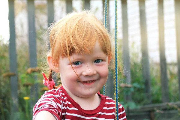 Portrait of the charming red-haired smiling girl — Stock Photo, Image