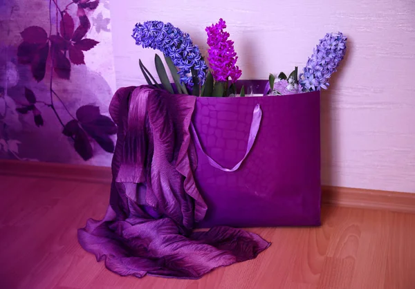 Ultraviolet gift with three purple hyacinths and a violet scarf — Stock Photo, Image