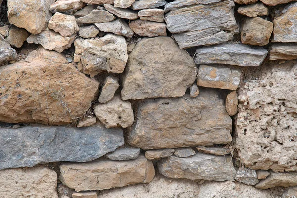 Ein Fragment Einer Alten Steinmauer Aus Groben Steinen Hintergrund Ocker — Stockfoto