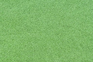 Parlak yeşil çimlerin taklidi olan yapay bir halı parçası. Geçmişi. Desen.