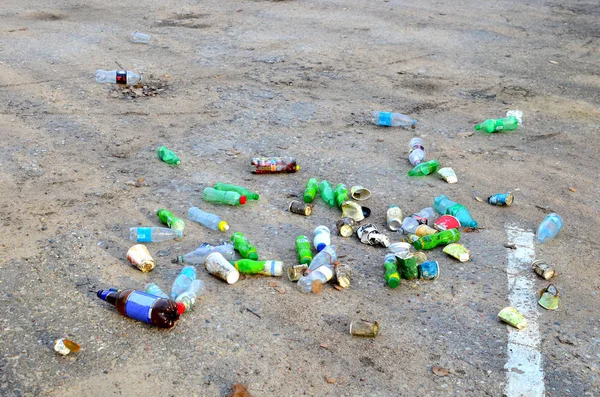 People throw away plastic bottles, bags and food waste, leave trash on the street after themselves. The concept of environmental pollution and environmental problems.