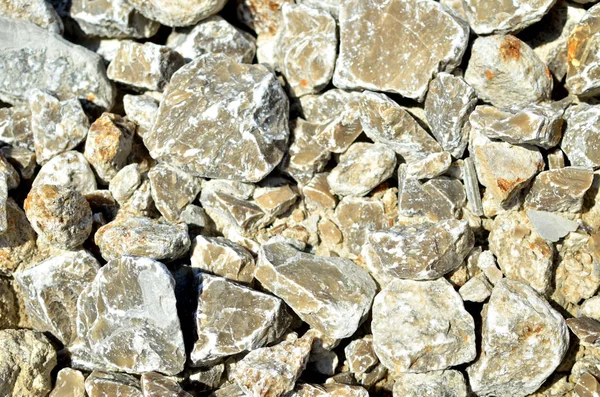 Natural gray gypsum stone. Close up image of stones with black and white. Industrial mining area. Limestone mining, quarry - Image