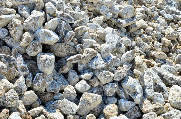 Natural gray gypsum stone. Close up image of stones with black and white. Industrial mining area. Limestone mining, quarry - Image