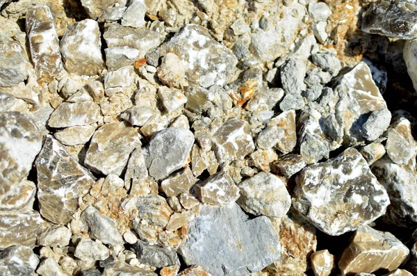 Natural gray gypsum stone. Close up image of stones with black and white. Industrial mining area. Limestone mining, quarry - Image