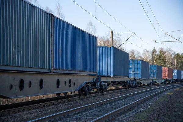 Cargo containers transportation on freight train by railway. Coronavirus Wreaks Havoc On Global Industry. Global economy is heading into a recession thanks to the widening fallout from the COVID-19