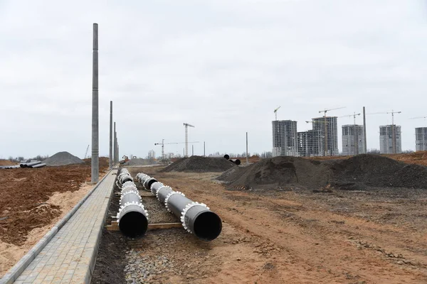 Cast iron sewer pipes for laying an external sewage system at a construction site. Sanitary drainage system for a multi-story building. Civil infrastructure pipe, water lines and storm sewers