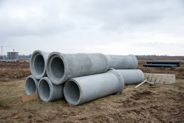 Concrete sewer pipes for laying an external sewage system at a construction site. Sanitary drainage system for a multi-story building. Civil infrastructure pipe, water lines and storm sewers