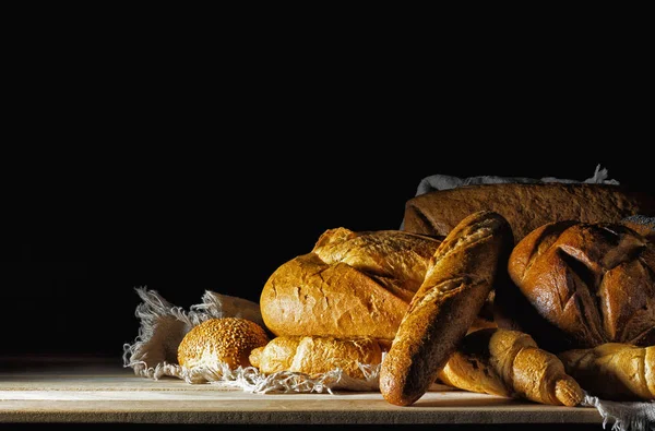 Buns and bread on the table. — Stock Photo, Image