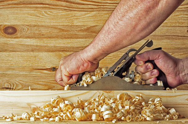 Plane on the background of wooden wall