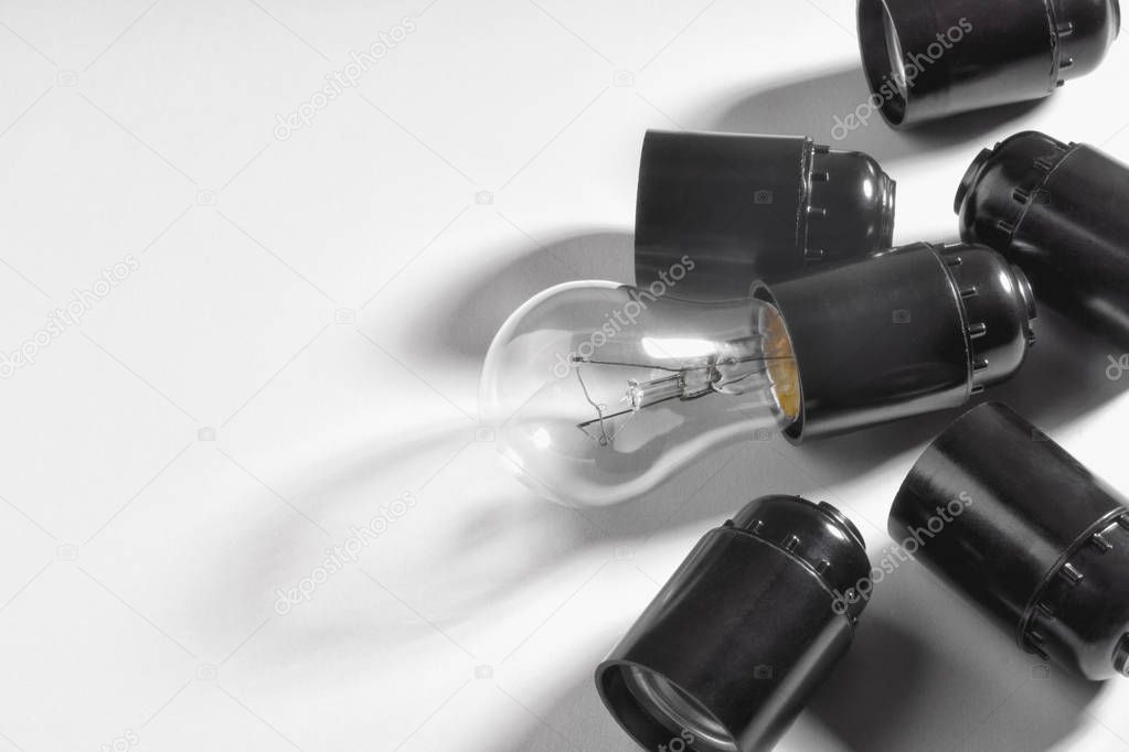 Electric bulb in the cartridge on a light background