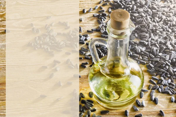 Olio vegetale in una bottiglia e semi — Foto Stock