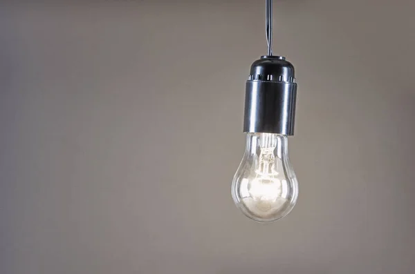 Connected lamp hanging on a wire — Stock Photo, Image
