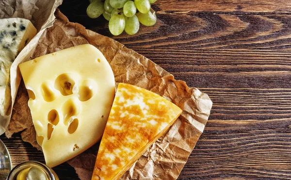 Cheese surrounded by other products — Stock Photo, Image