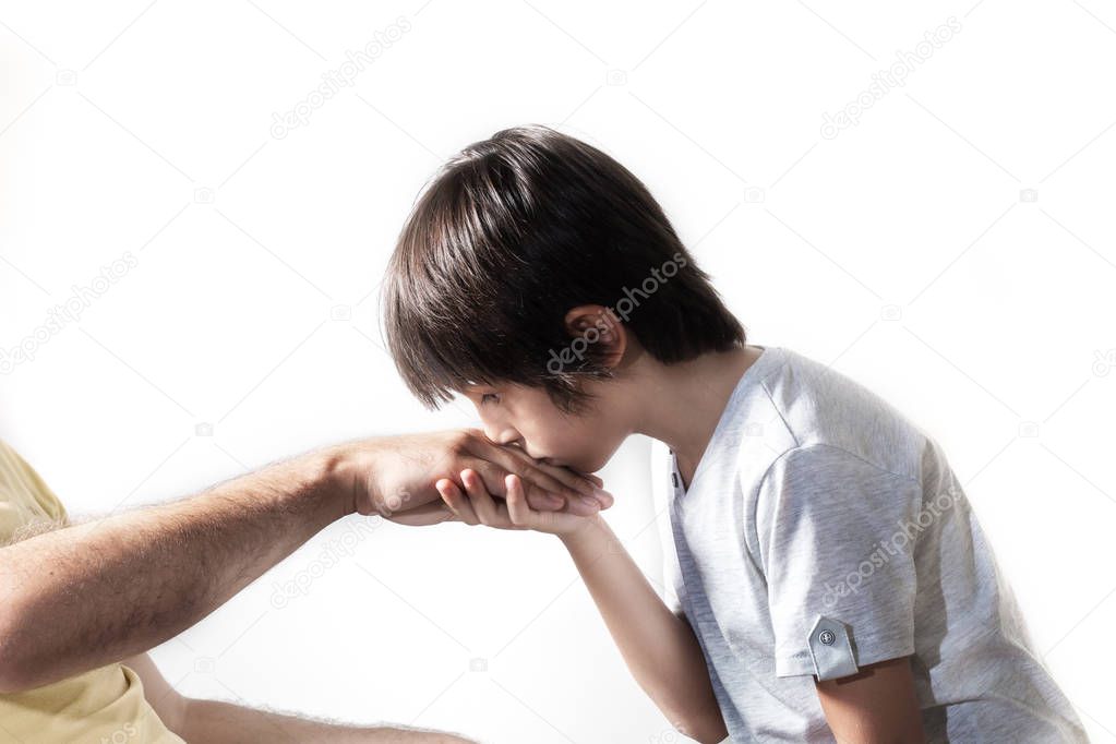 Kid kissing parent's hand