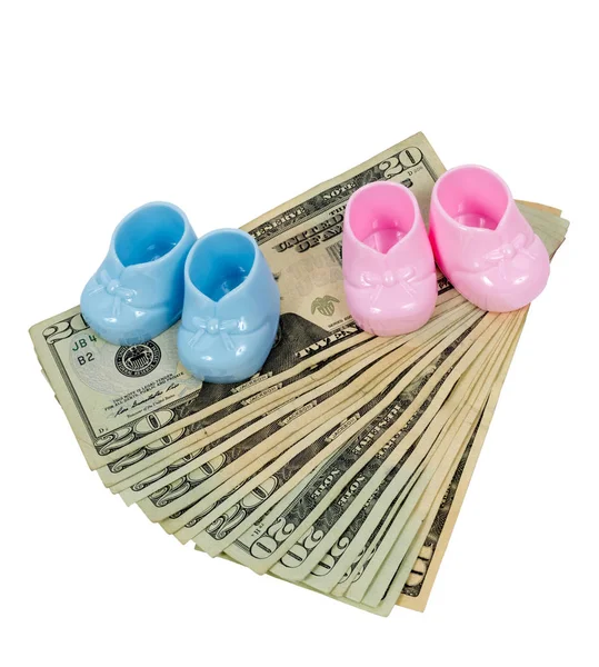 Pink and Blue Plastic Booties Sitting on Fanned Out Twenty Dolla — Stock Photo, Image