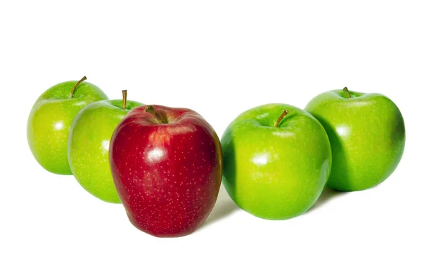 Red Apple Standing in Front of Green Apples — Stock Photo, Image