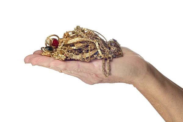 Sujeción de la mano joyas de oro aislado en blanco — Foto de Stock