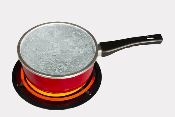 Steaming Pot Of Boiling Water On Red Hot Electric Stove Burner