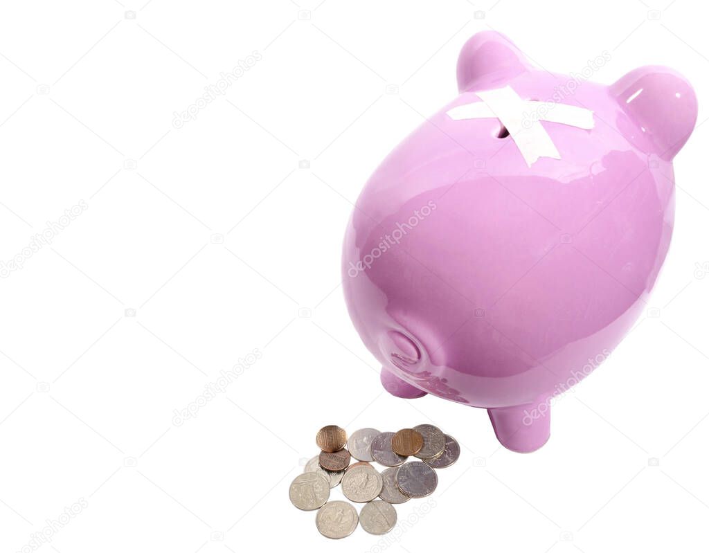 Horizontal shot of a pink piggy bank from the back with a pile of coins behind him.  Two pieces of tape crossed over the slot on his back.  White background.  Copy space.