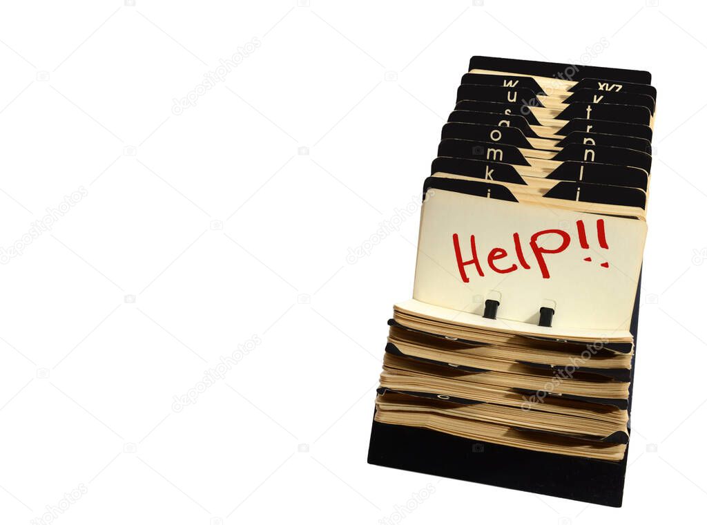 Horizontal shot of a vintage Rolodex opened to a card that reads Help in red letters.  White background with lots of copy space on the left side of image.