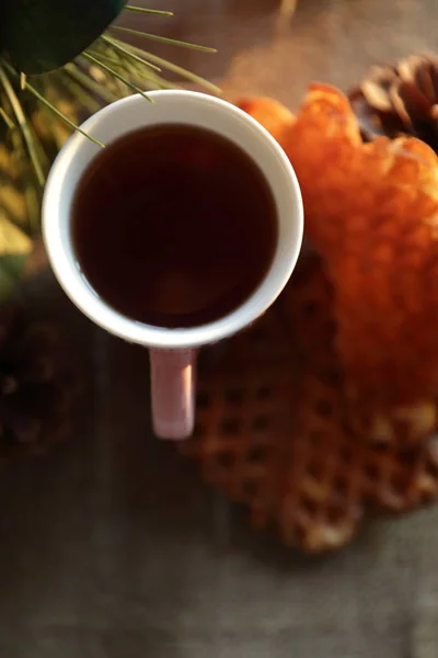 Tea and waffle at sunset — Stock Photo, Image