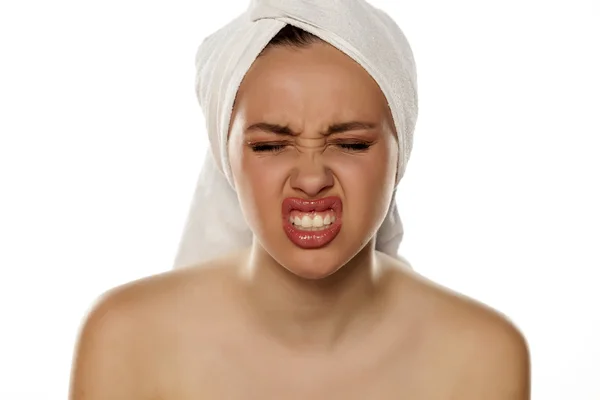 Woman with towel on her head — Stock Photo, Image
