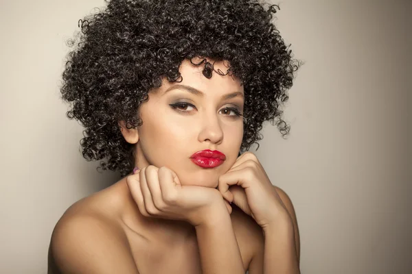 Woman with black curly wig — Stock Photo, Image