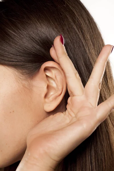 Palm behind an ear — Stock Photo, Image