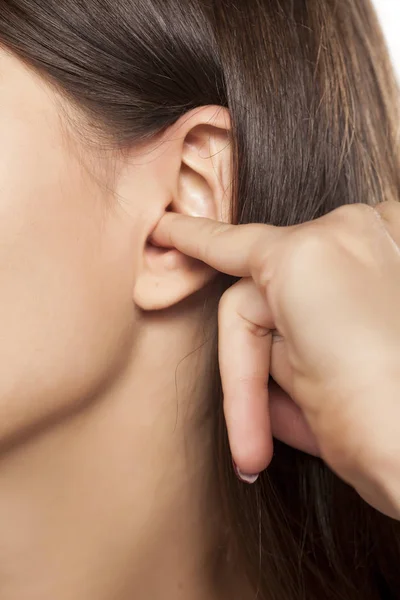 Finger in an ear — Stock Photo, Image