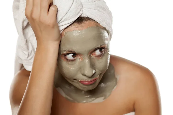 Woman with a mud mask — Stock Photo, Image