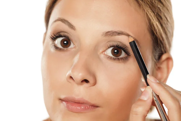 Mujer haciendo maquillaje — Foto de Stock