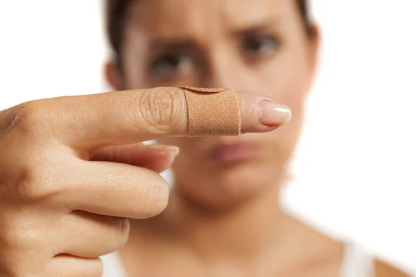 Woman with hurt finger — Stock Photo, Image