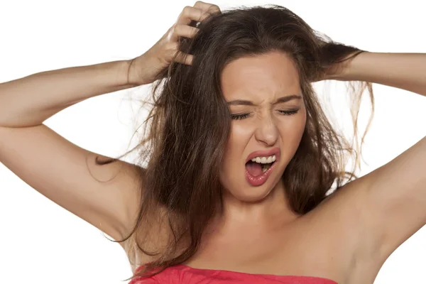 Woman with itchy scalp — Stock Photo, Image