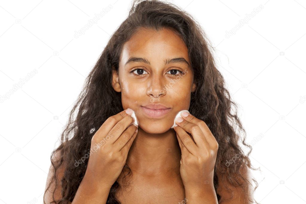 girl cleaning her face