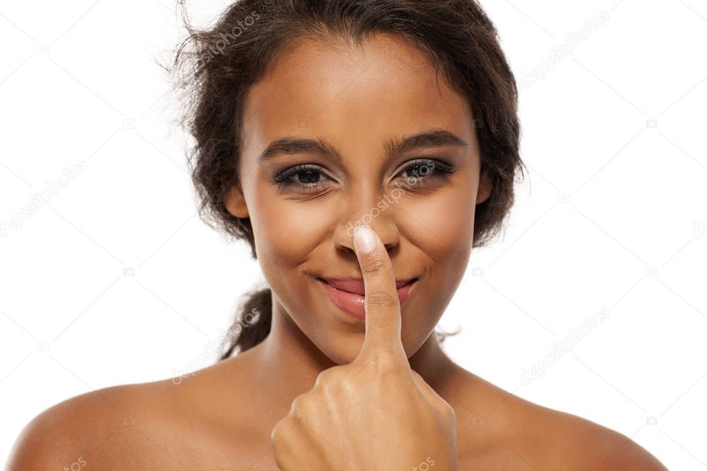 woman touching her nose
