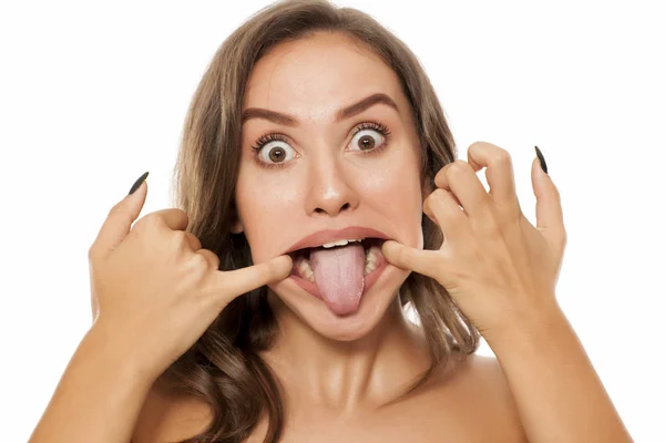 Young Woman Making Funny Faces White Background — Stock Photo, Image