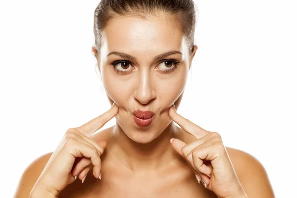 Skin care - face stretching — Stock Photo, Image