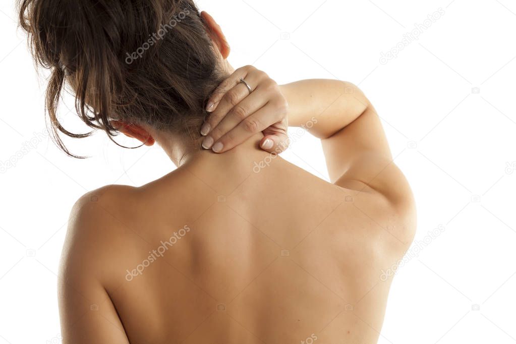 Back view of a woman with pain in her neck and shoulders