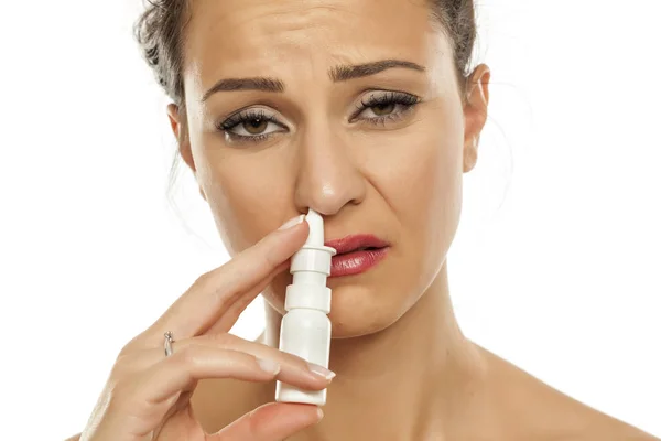 Sad Young Woman Spraying Nasal Drops Her Nose — Stock Photo, Image