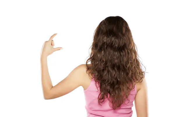 Back View Young Woman Holding Imaginary Object Her Fingers — Stock Photo, Image