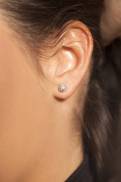 Closeup Female Ear Small Luxurious Stud Earring — Stock Photo, Image