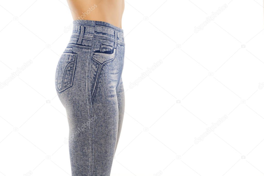 Side view of a woman in denim print leggings on a white background