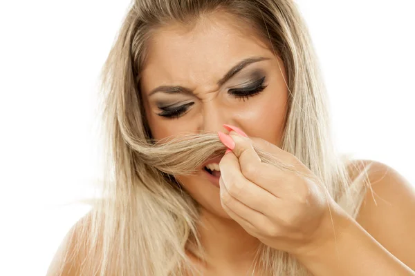 Young Woman Unsatisfied Smell Her Hair — Stock Photo, Image
