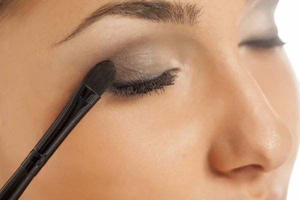 Young Woman Applying Eye Shadow Brush Royalty Free Stock Images