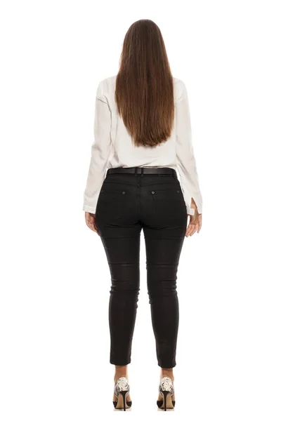 Vista Posterior Una Mujer Jeans Negros Camisa Blanca Tacones Altos —  Fotos de Stock