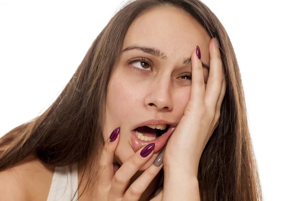 Desperate Young Woman Stretching Out Her Face — Stock Photo, Image