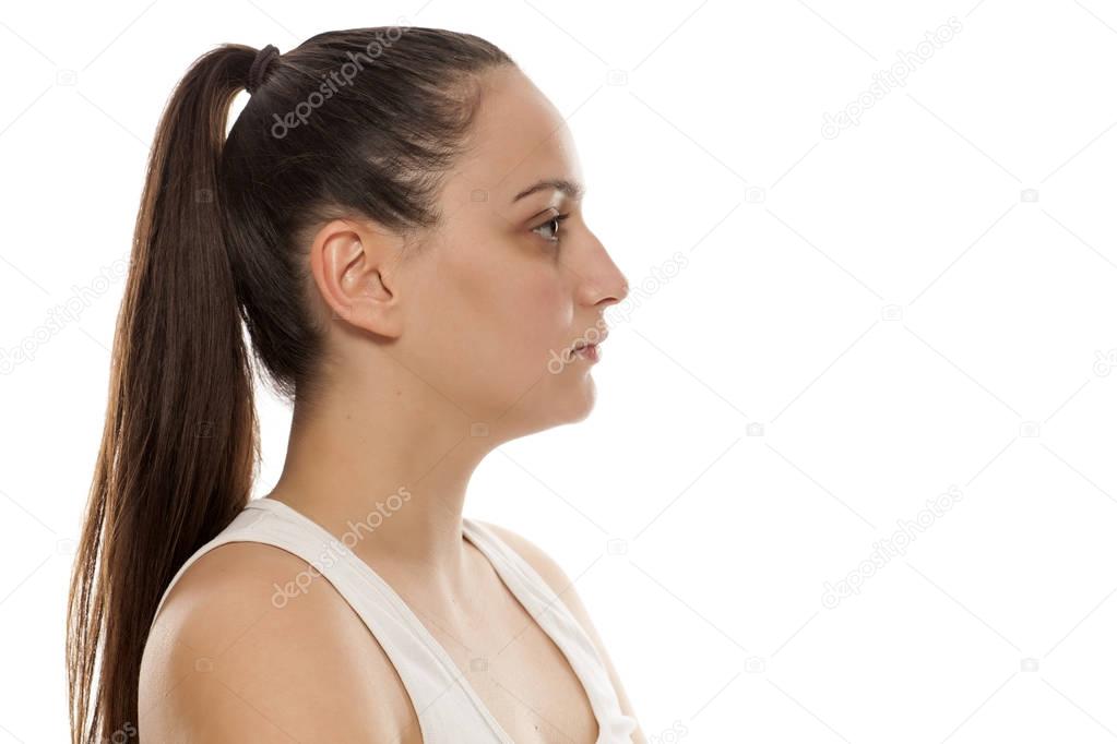 Profile view of a beautiful young woman without makeup