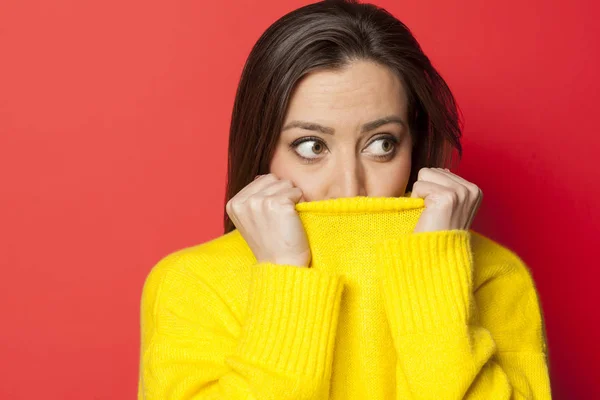 Beautiful Afraid Woman Yellow Sweater Red Background — Stock Photo, Image